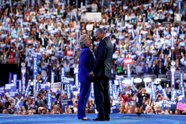 democratic presidential nominee hillary clinton joins u s president barack obama onstage after his remarks on the third night of the democratic national convention in philadelphia pennsylvania u s photo reuters