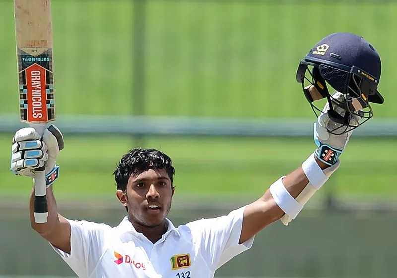 kusal mendis raises his bat and helmet in celebration after scoring a century at the pallekele international cricket stadium in pallekele on july 28 2016 photo afp kusal mendis raises his bat and helmet in celebration after scoring a century at the pallekele international cricket stadium in pallekele on july 28 2016 photo afp