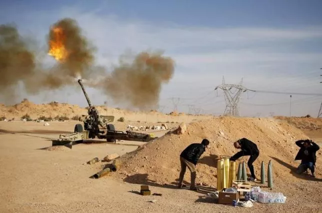 libya dawn fighters fire an artillery cannon at is militants near sirte march 19 2015 photo reuters libya dawn fighters fire an artillery cannon at is militants near sirte march 19 2015 photo reuters