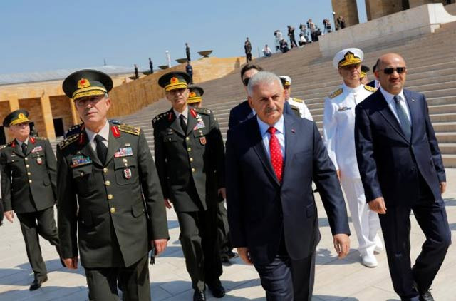 turkey 039 s prime minister binali yildirim c flanked by chief of staff general hulusi akar l defense minister fikri isik r and the country 039 s top generals leaves anitkabir the mausoleum of modern turkey 039 s founder mustafa kemal ataturk after a wreath laying ceremony ahead of a high military council meeting in ankara turkey july 28 2016 photo reuters