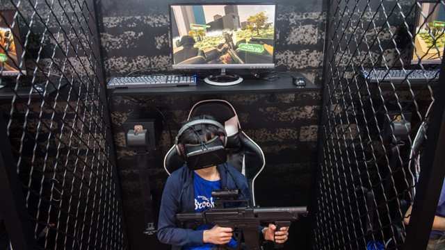 a visitor plays a virtual reality game called quot hong kong infected quot by production house yyy industry at the annual ani com show in hong kong on july 29 2016 photo afp a visitor plays a virtual reality game called quot hong kong infected quot by production house yyy industry at the annual ani com show in hong kong on july 29 2016 photo afp