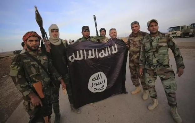 fighters pose with an islamic state flag photo reuters fighters pose with an islamic state flag photo reuters