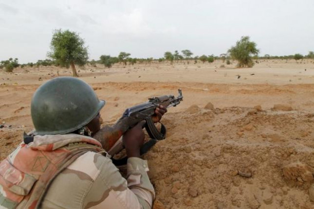 a niger soldier guards with his weapon pointed towards the border with neighbouring nigeria near the town of diffa niger photo rueters a niger soldier guards with his weapon pointed towards the border with neighbouring nigeria near the town of diffa niger photo rueters