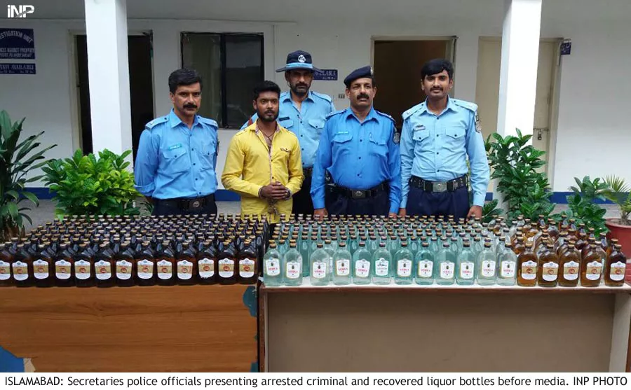 the shalimar police arrested a bootlegger ziarat gul and seized 20 liters of liquor from him photo inp the shalimar police arrested a bootlegger ziarat gul and seized 20 liters of liquor from him photo inp
