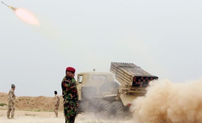 iraqi soldiers fire a rocket toward islamic state militants on the outskirts of the makhmour south of mosul iraq photo reuters