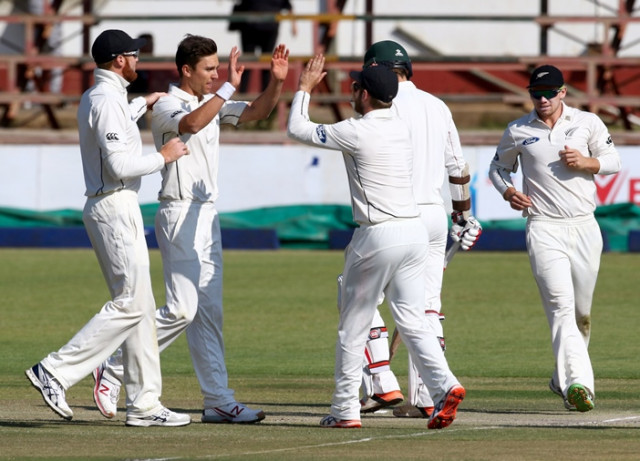 new zealand bowler trent boult c celebrates a wicket with his teammates during the fourth day of the first test match in a series of two tests between new zealand and hosts zimbabwe at queens sports club in bulawayo july 31 2016 photo afp new zealand bowler trent boult c celebrates a wicket with his teammates during the fourth day of the first test match in a series of two tests between new zealand and hosts zimbabwe at queens sports club in bulawayo july 31 2016 photo afp