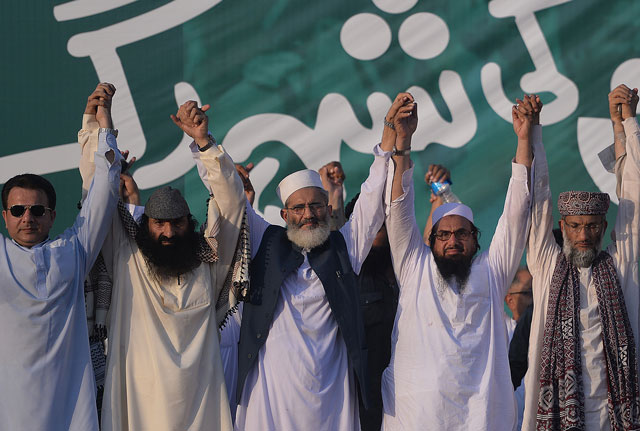 hizbul mujahideen and religious parties leaders joined hands at a rally to show solidarity with indian kashmiri muslims as they observed a 039 black day 039 to denounce the actions of indian security forces in indian administered kashmir in islamabad on july 20 2016 photo afp