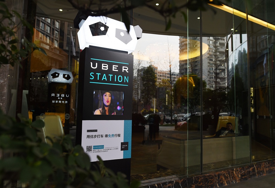 ride sharing giant uber is to merge its china operations with local rival didi chuxing photo afp