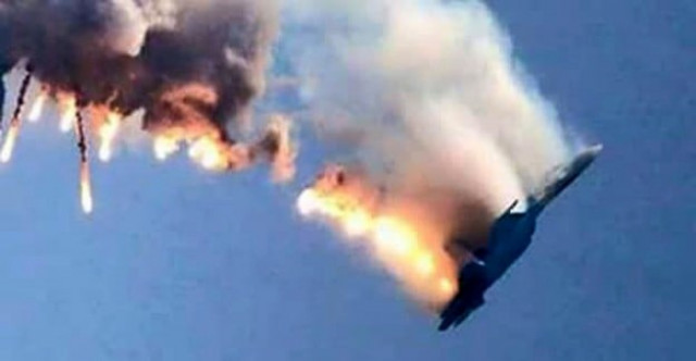 an image grab made from a video shows a burning russian fighter jet coming down after being shot down near the turkish syrian border in hatay on november 24 2015 photo afp an image grab made from a video shows a burning russian fighter jet coming down after being shot down near the turkish syrian border in hatay on november 24 2015 photo afp