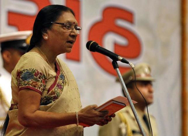 anandiben patel the newly appointed chief minister of the western indian state of gujarat takes her oath during a swearing in ceremony at gandhinagar in gujarat may 22 2014 photo reuters