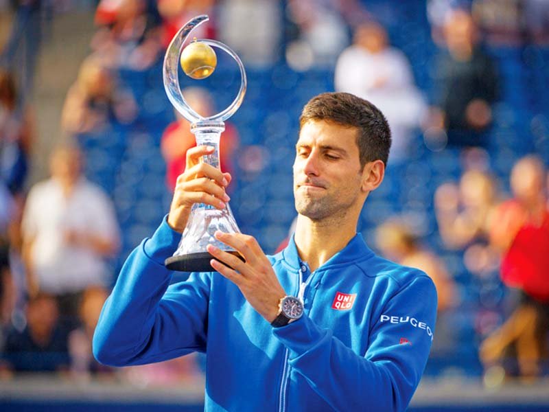 in his first tournament since an upset third round loss to american sam querrey at wimbledon djokovic returned to his winning ways and became the first four time winner of the rogers cup photo afp