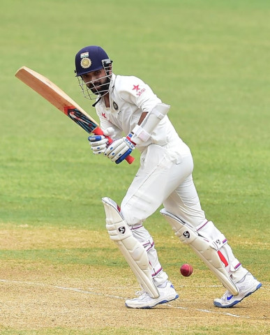 ajinkya rahane connects for a hit off bowler miguel cummins at sabina park in kingston jamaica photo afp ajinkya rahane connects for a hit off bowler miguel cummins at sabina park in kingston jamaica photo afp