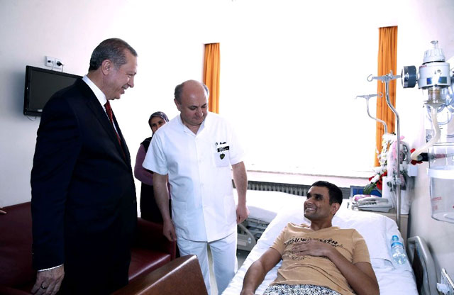turkish president recep tayyip erdogan l visits a terror attack victim at the gulhane military medical academy gata in ankara in february 2016 photo afp