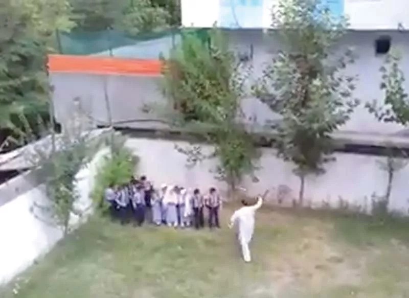 a screengrab shows the teacher using a stick to beat students photo express a screengrab shows the teacher using a stick to beat students photo express