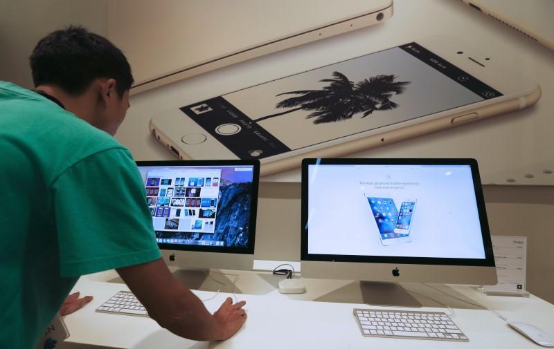 a sales assistant shows features of ios 9 on an apple imac at an apple reseller shop in bangkok september 18 2015 photo reuters