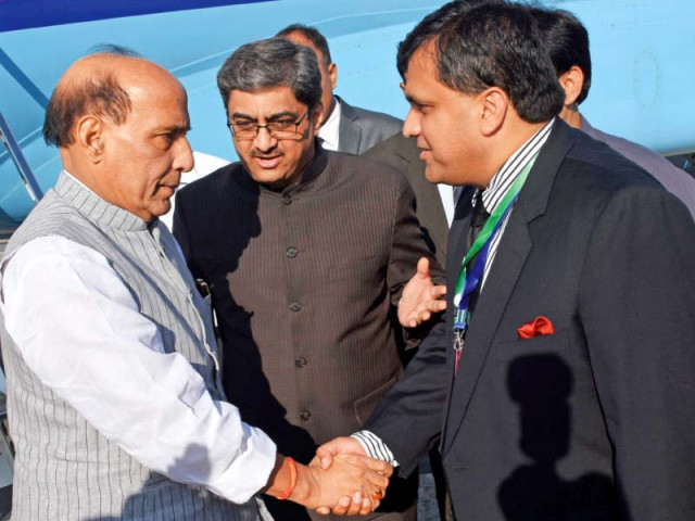 a senior pakistani official greets indian home minister rajnath singh photo afp a senior pakistani official greets indian home minister rajnath singh photo afp