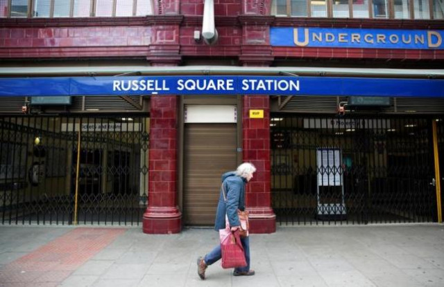 a woman walks past a closed entrance of russell square underground station in london april 29 2014 photo reuters a woman walks past a closed entrance of russell square underground station in london april 29 2014 photo reuters
