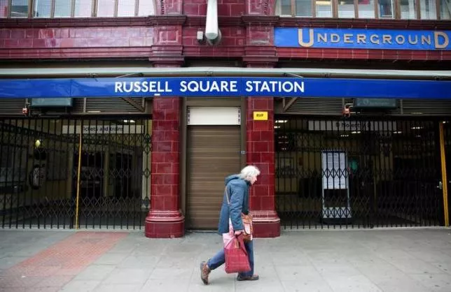 a woman walks past a closed entrance of russell square underground station in london april 29 2014 photo reuters a woman walks past a closed entrance of russell square underground station in london april 29 2014 photo reuters