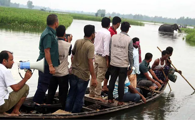 in this photograph taken on august 1 2016 bangladesh wildlife officials look on from a boat as they observe a wild elephant in a watercourse at sarishabari in jamalpur district some 150km north of dhaka photo afp in this photograph taken on august 1 2016 bangladesh wildlife officials look on from a boat as they observe a wild elephant in a watercourse at sarishabari in jamalpur district some 150km north of dhaka photo afp