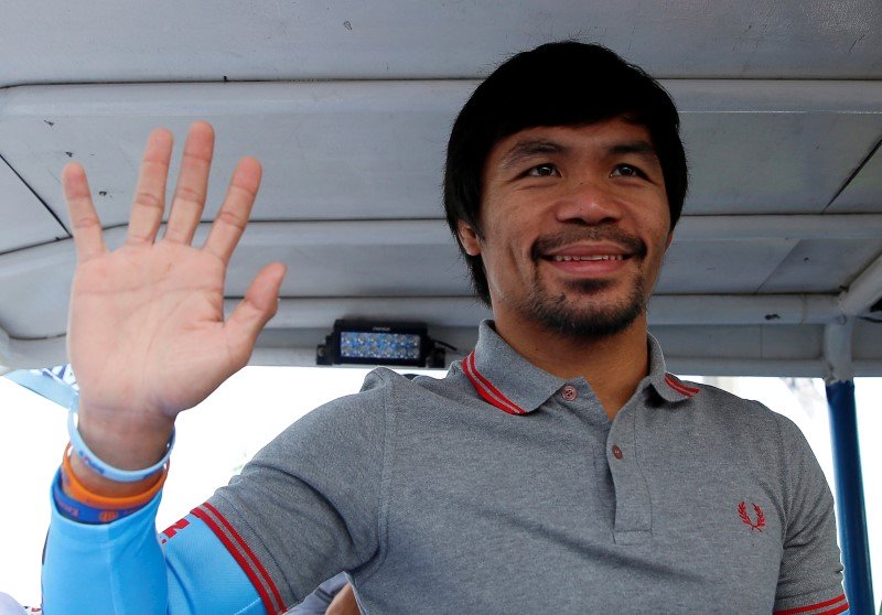 former filipino boxer and senator manny pacquiao waves from a truck during election campaigning in malabon metro manila in the philippines may 6 2016 photo reuters