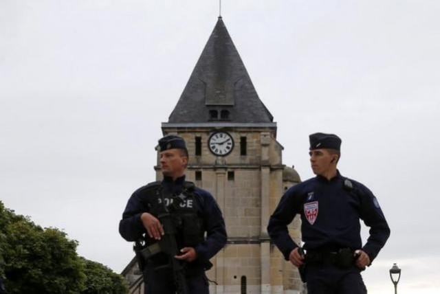 french crs police stand guard in front of the church photo reuters french crs police stand guard in front of the church photo reuters