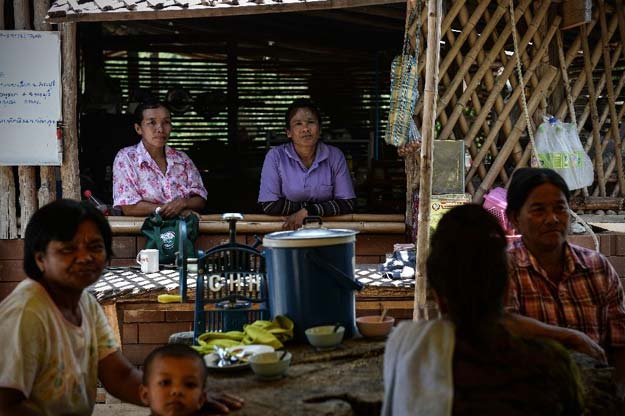 residents who have adopted renewable energy relaxing at the community center of pa deng village photo afp