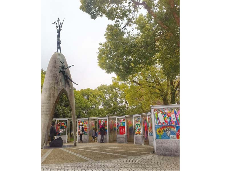 the children s peace monument with sadako standing on the top holding her paper crane photo courtesy manahil sardar