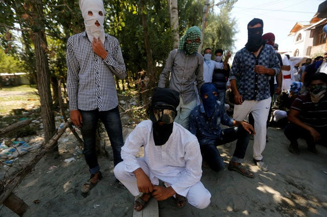 masked protesters pose before the start of a protest against the recent killings in kashmir on the outskirts of srinagar august 5 2016 photo reuters