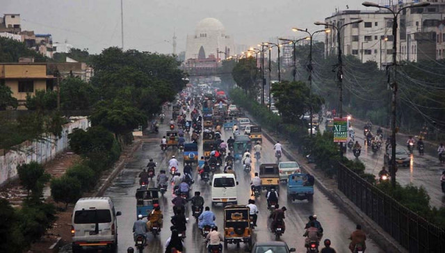 commuters pass through ma jinnah raod after it rained in karachi the meteorological department director said that it rained in all parts of the city photo online commuters pass through ma jinnah raod after it rained in karachi the meteorological department director said that it rained in all parts of the city photo online