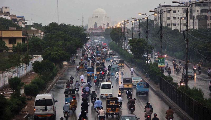 commuters pass through ma jinnah raod after it rained in karachi the meteorological department director said that it rained in all parts of the city photo online