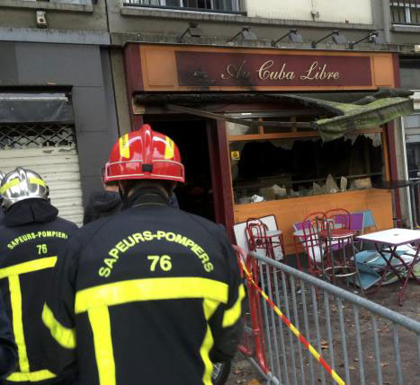 firemen walk outside the bar in rouen france august 6 2016 where a fire killed 13 people and injured another six according to a statement by the interior ministry photo reuters