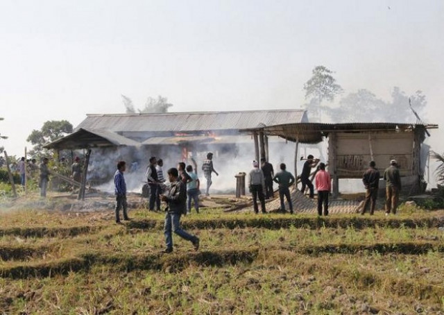 tribal plantation workers burn houses belonging to indigenous bodo tribesmen after ethnic clashes in balijuri village photo reuters