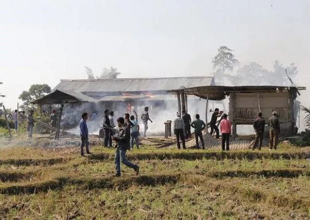 tribal plantation workers burn houses belonging to indigenous bodo tribesmen after ethnic clashes in balijuri village photo reuters tribal plantation workers burn houses belonging to indigenous bodo tribesmen after ethnic clashes in balijuri village photo reuters