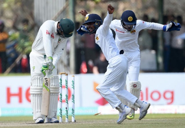 sri lankan wicketkeeper dinesh chandimal r and fielder kaushal silva c celebrate after the dismissal of australian batsman usman khawaja l during the second day of the second test cricket match between sri lanka and australia at the galle international cricket stadium in galle on august 5 2016 photo afp sri lankan wicketkeeper dinesh chandimal r and fielder kaushal silva c celebrate after the dismissal of australian batsman usman khawaja l during the second day of the second test cricket match between sri lanka and australia at the galle international cricket stadium in galle on august 5 2016 photo afp