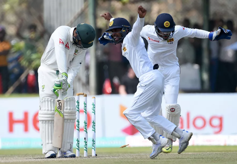 sri lankan wicketkeeper dinesh chandimal r and fielder kaushal silva c celebrate after the dismissal of australian batsman usman khawaja l during the second day of the second test cricket match between sri lanka and australia at the galle international cricket stadium in galle on august 5 2016 photo afp sri lankan wicketkeeper dinesh chandimal r and fielder kaushal silva c celebrate after the dismissal of australian batsman usman khawaja l during the second day of the second test cricket match between sri lanka and australia at the galle international cricket stadium in galle on august 5 2016 photo afp