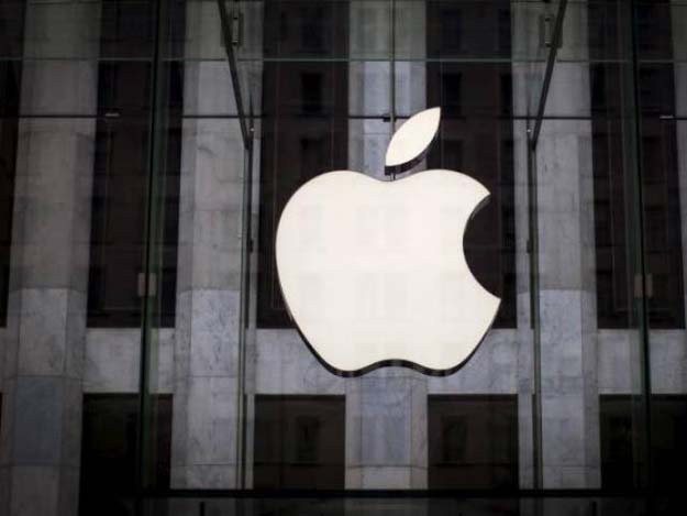 an apple logo hangs above the entrance to the apple store on 5th avenue in new york city photo reuters