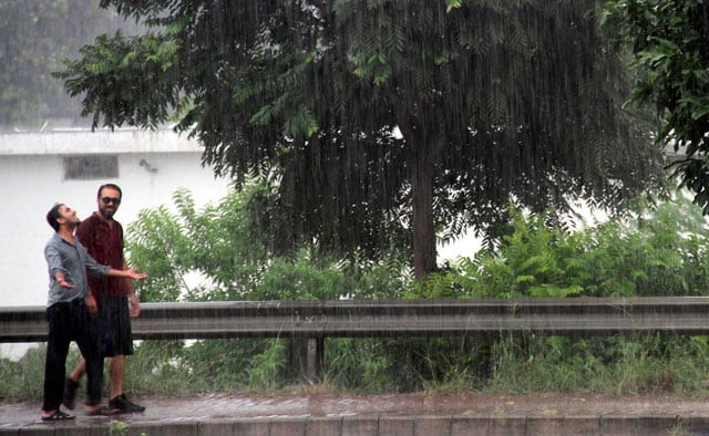 people enjoy rain after a couple of hot and humid days in the federal capital on august 6 2016 photo inp people enjoy rain after a couple of hot and humid days in the federal capital on august 6 2016 photo inp