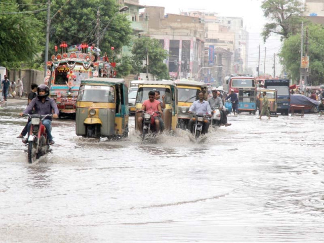 commuters drive through rainwater after a heavy downpour in the saddar area of karachi on saturday photo athar khan commuters drive through rainwater after a heavy downpour in the saddar area of karachi on saturday photo athar khan