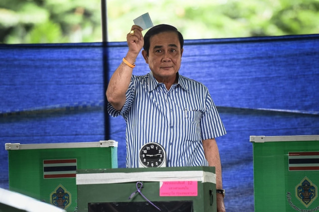 thai prime minister prayuth chan ocha holds up his ballot at his local polling station during the constitutional referendum in bangkok photo afp thai prime minister prayuth chan ocha holds up his ballot at his local polling station during the constitutional referendum in bangkok photo afp