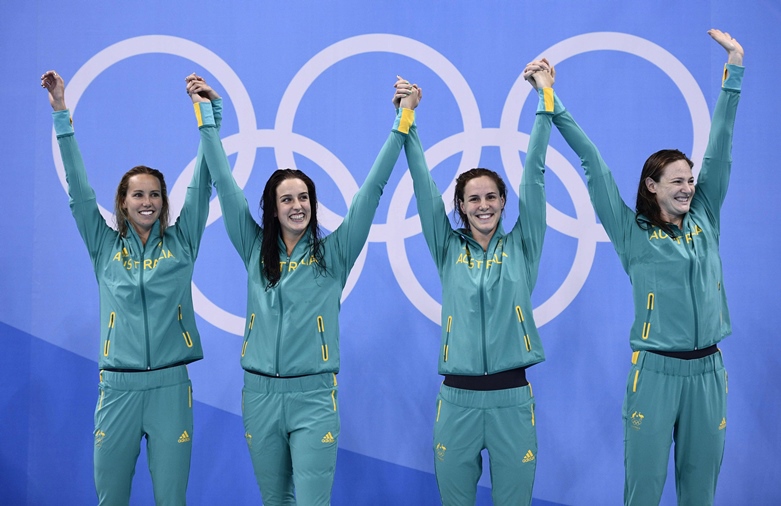 australia 039 s emma mckeon australia 039 s brittany elmslie australia 039 s bronte campbell and australia 039 s cate campbell celebrate on the podium after they broke the world in the women 039 s 4 x 100m freestyle relay final during the swimming event at the rio 2016 olympic games at the olympic aquatics stadium in rio de janeiro on august 6 2016 photo afp