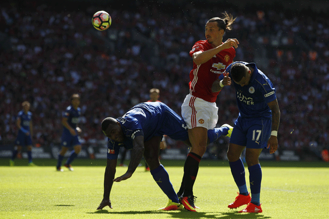 manchester united 039 s swedish striker zlatan ibrahimovic c heads the ball between leicester city 039 s english defender danny simpson r and leicester city 039 s english defender wes morgan l during the fa community shield football match between manchester united and leicester city at wembley stadium in london on august 7 2016 photo afp