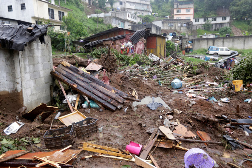 damaged houses and debris are seen after a mudslide following heavy showers caused by the passing of tropical storm earl in the town of huauchinango in puebla state mexico august 7 2016 photo reuters