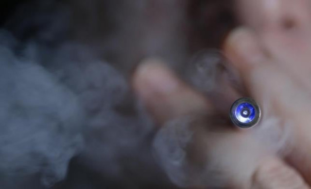 a man uses an e cigarette an electronic substitute in the form of a rod slightly longer than a normal cigarette in this illustration picture photo reuters a man uses an e cigarette an electronic substitute in the form of a rod slightly longer than a normal cigarette in this illustration picture photo reuters