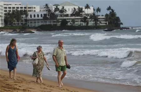 tourists walk along the mount lavinia beach in colombo june 13 2011 photo reuters tourists walk along the mount lavinia beach in colombo june 13 2011 photo reuters