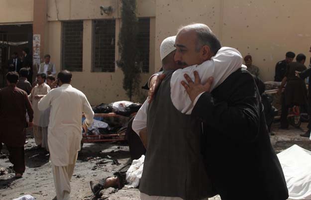 friends and relatives of victims grieve at the scene of a bomb blast outside a hospital in quetta august 8 2016 photo reuters