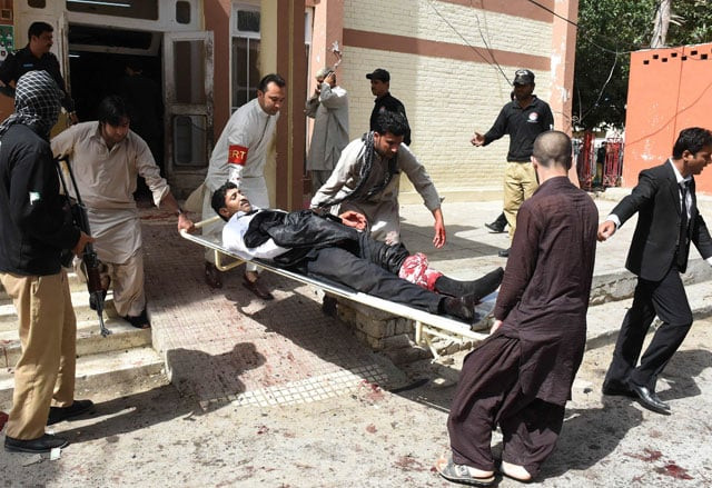 volunteers use a stretcher to move an injured lawyer after a bomb explosion at civil hospital premises in quetta on august 8 2016 photo afp volunteers use a stretcher to move an injured lawyer after a bomb explosion at civil hospital premises in quetta on august 8 2016 photo afp