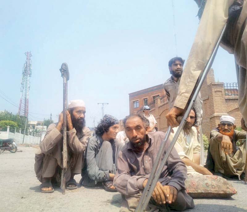 protesters sit outside peshawar press club photo express