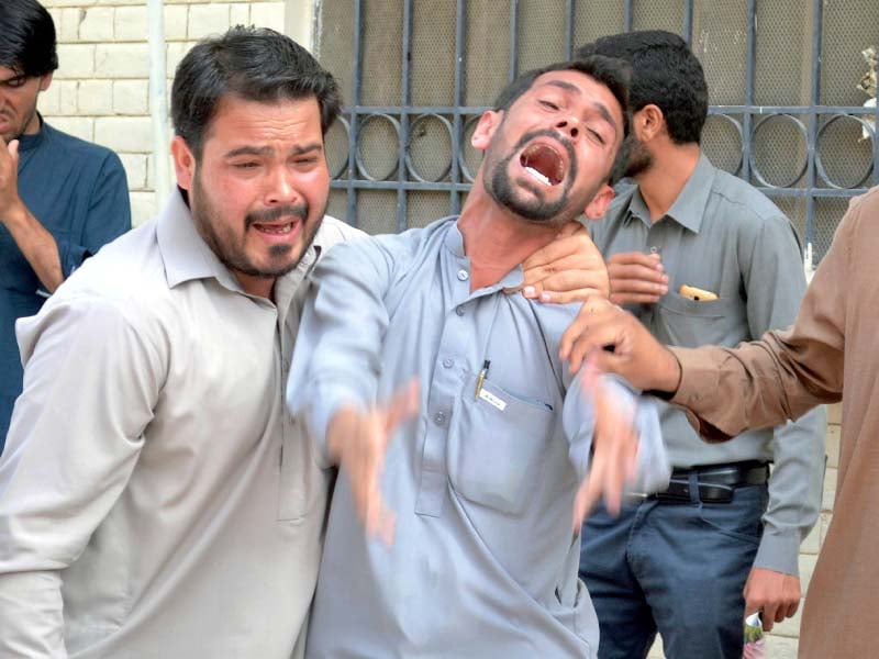 mourners react after a bombing at the quetta civil hospital photo afp