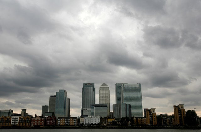 storm clouds are seen above the canary wharf financial district in london britain august 3 2010 photo reuters