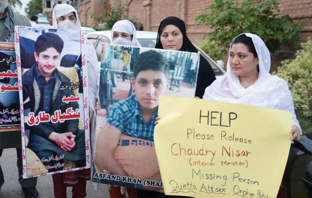 members of aps shuhada forum hold placards during a protest to condemn the deadly suicide blast in civil hospital in quetta photo express members of aps shuhada forum hold placards during a protest to condemn the deadly suicide blast in civil hospital in quetta photo express